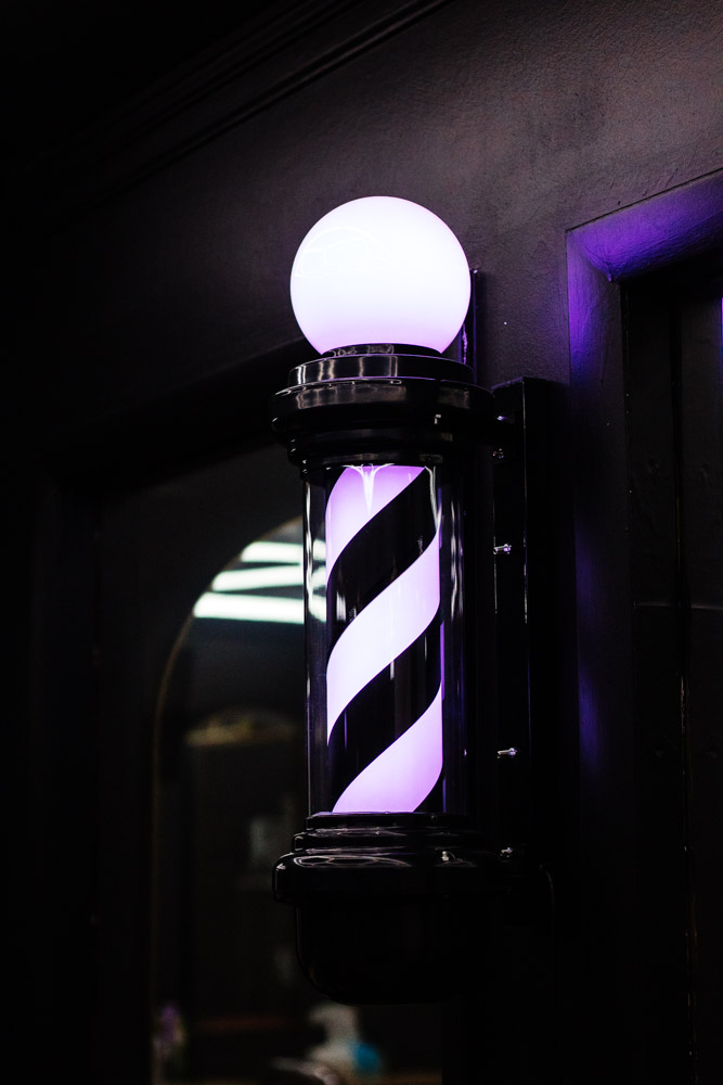 Illuminated barber pole in the New Edge Barbers shop
