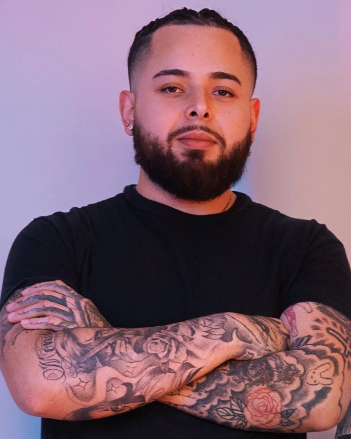 New Edge barber in a black T-shirt